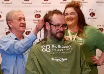Robb Drzewicki getting his head shaved by Dennis for St. Baldrick's